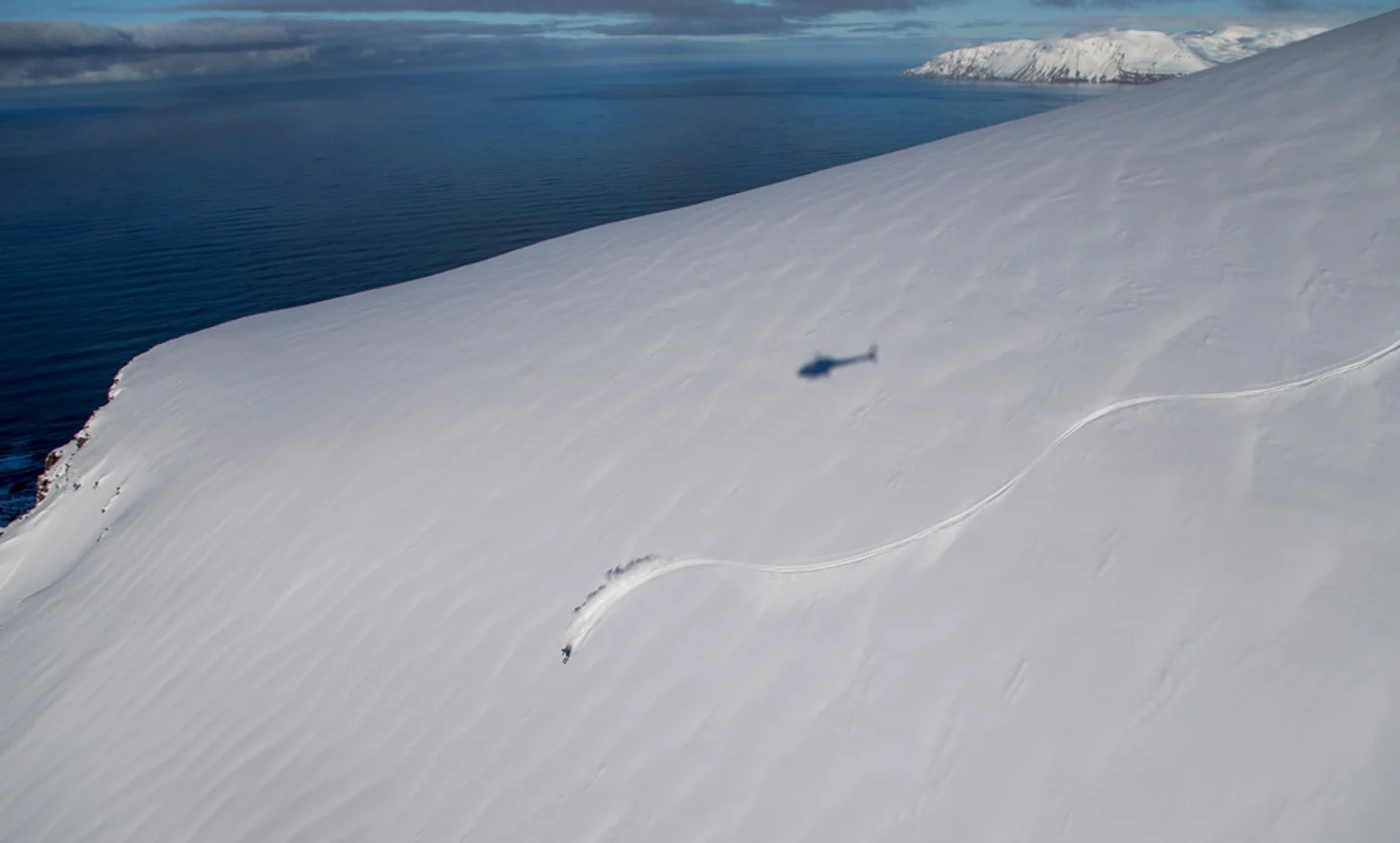 A skier descends in Iceland.