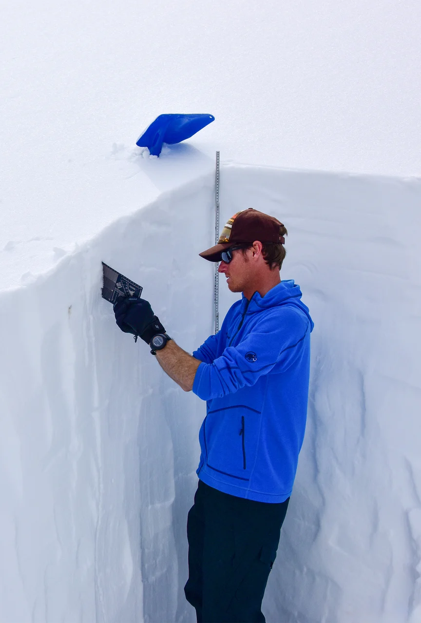 Ski guide practicing avalanche safety