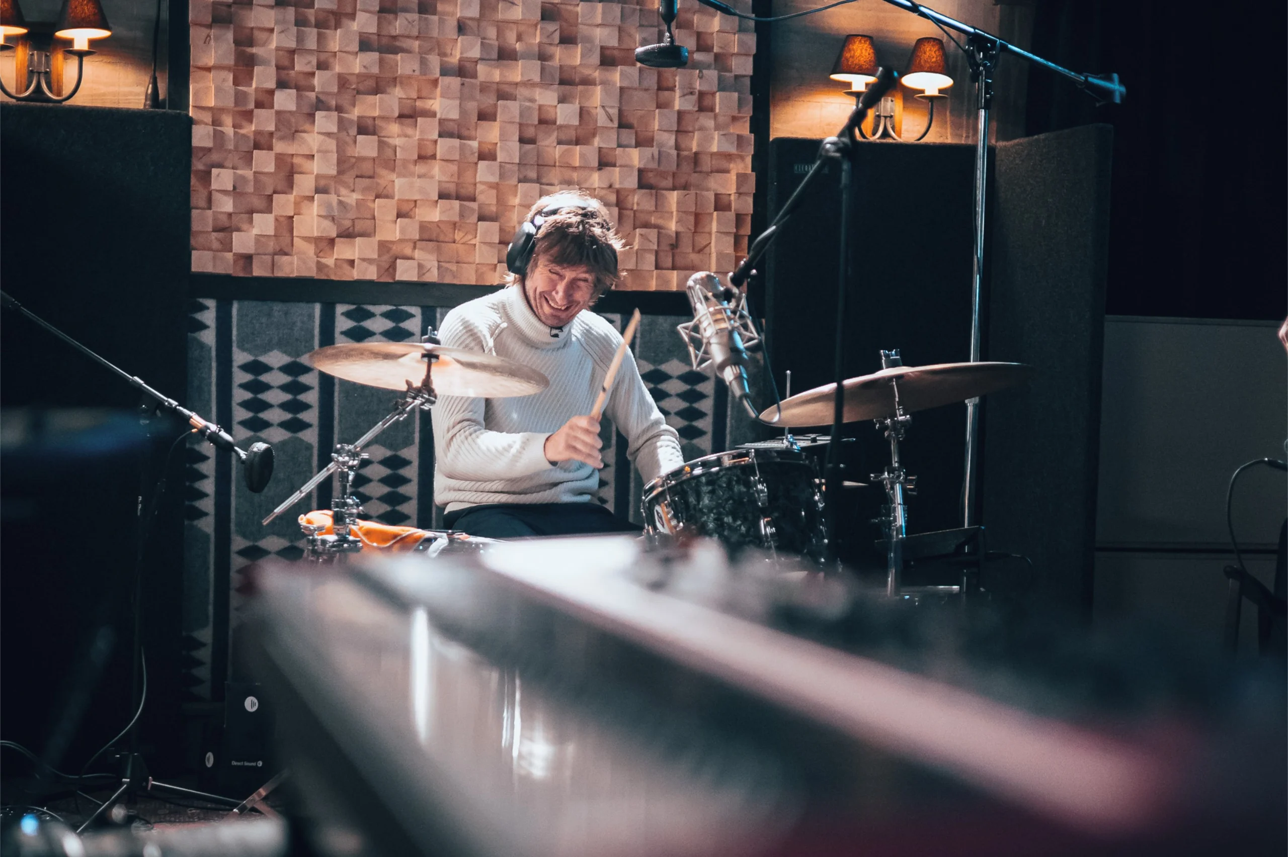 A drummer in Floki Studios enjoying playing a vintage Pearl kit.