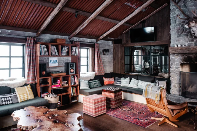 The living room in Floki fitted with comfy chairs, couches and TVs.