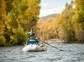 An angler casts from a boat on the Gunnison River