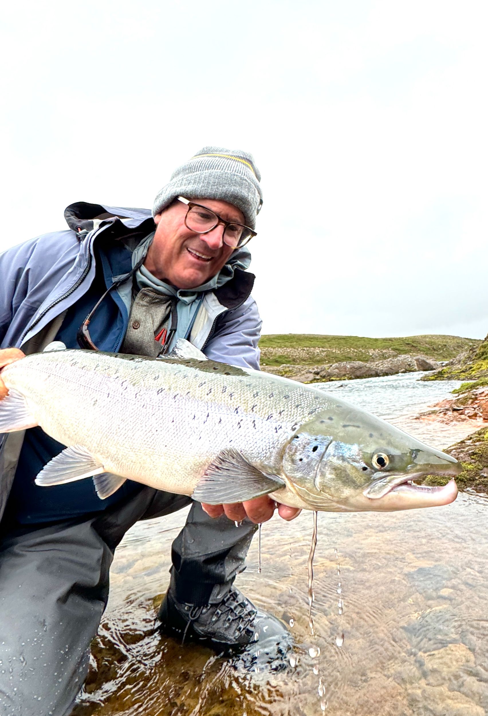 Angler with a catch in Iceland