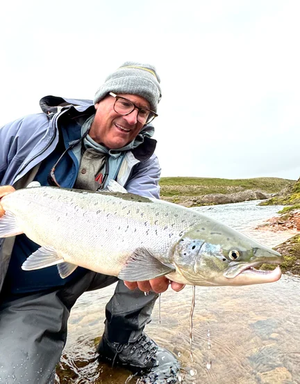 Angler with a catch in Iceland