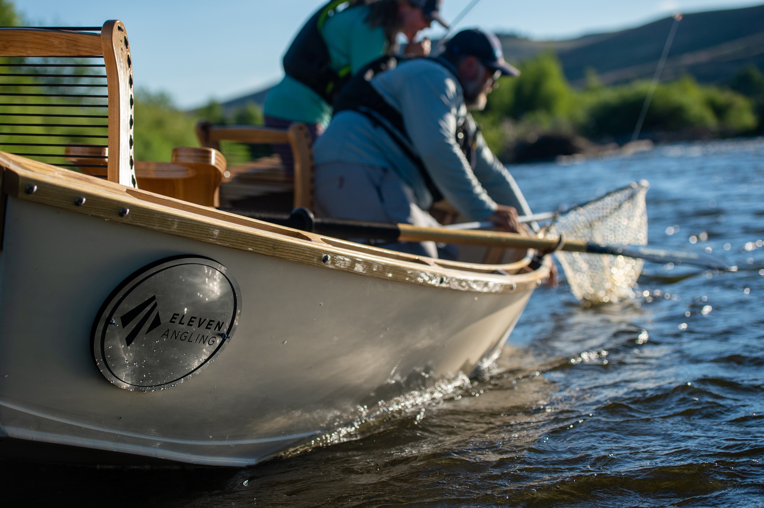 An angler nets a fish on the Gunnison River.