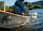 An angler nets a fish on the Gunnison River.