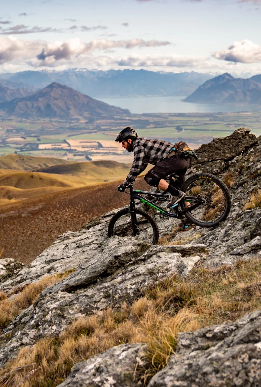 A mountain biker descends in New Zealand.