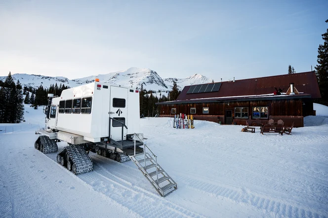 Eleven snow cat outside of cat ski barn in CO
