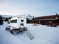 Eleven snow cat outside of cat ski barn in CO