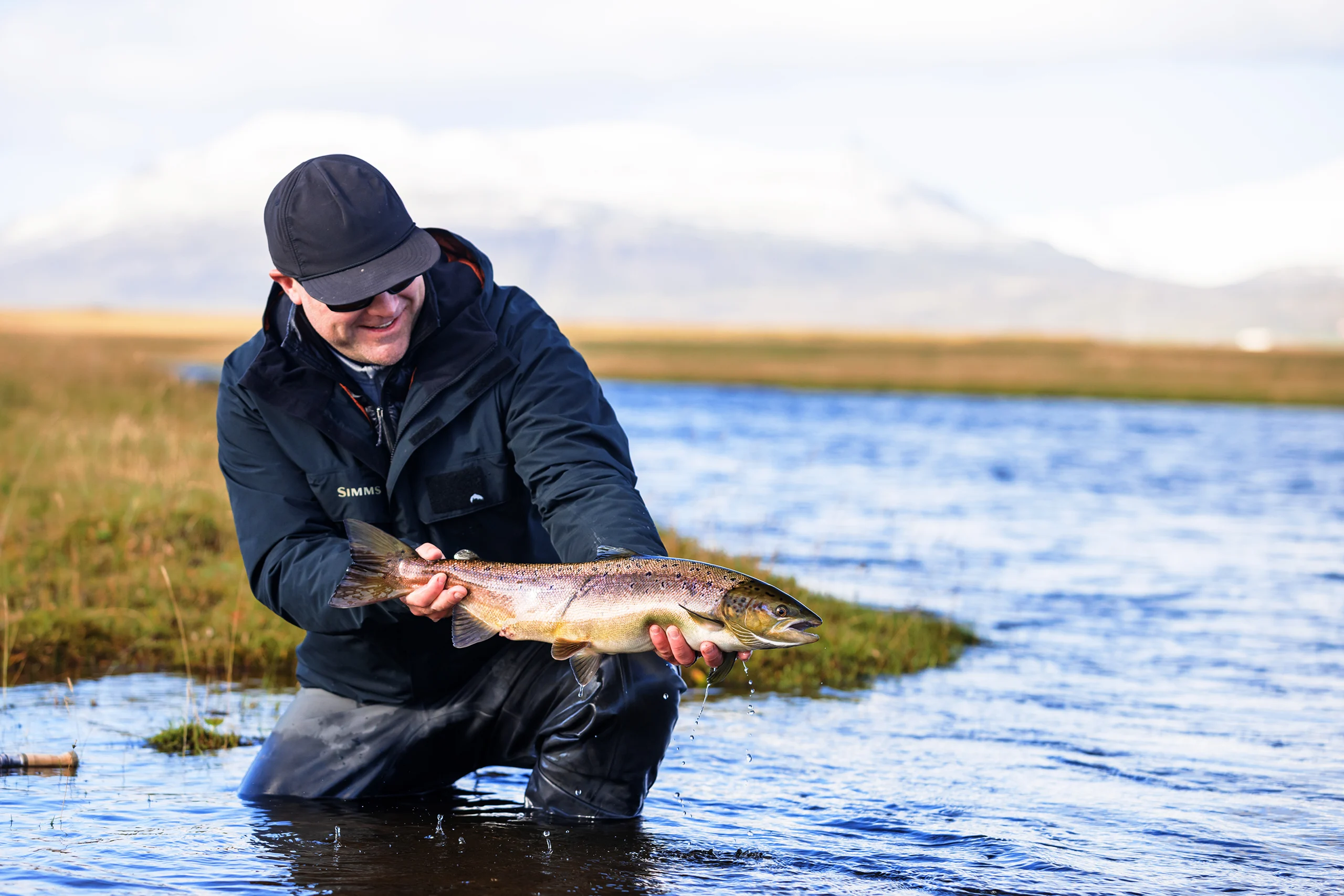 Man holding fish in Iceland
