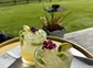 Lime cocktails on a table outdoors.