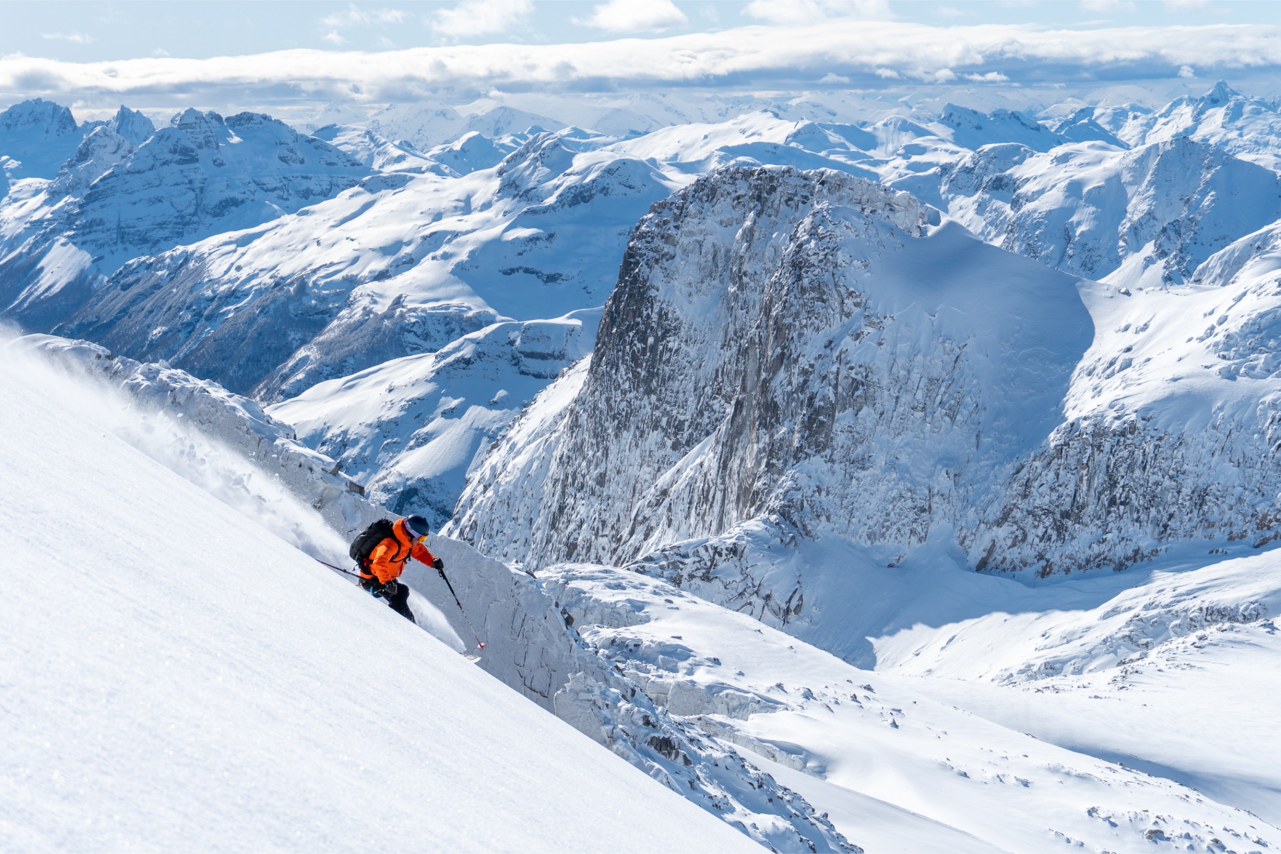 A person skiing downhill in a Chilean mountain range.