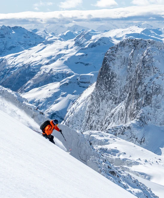 A person skiing downhill in a Chilean mountain range.