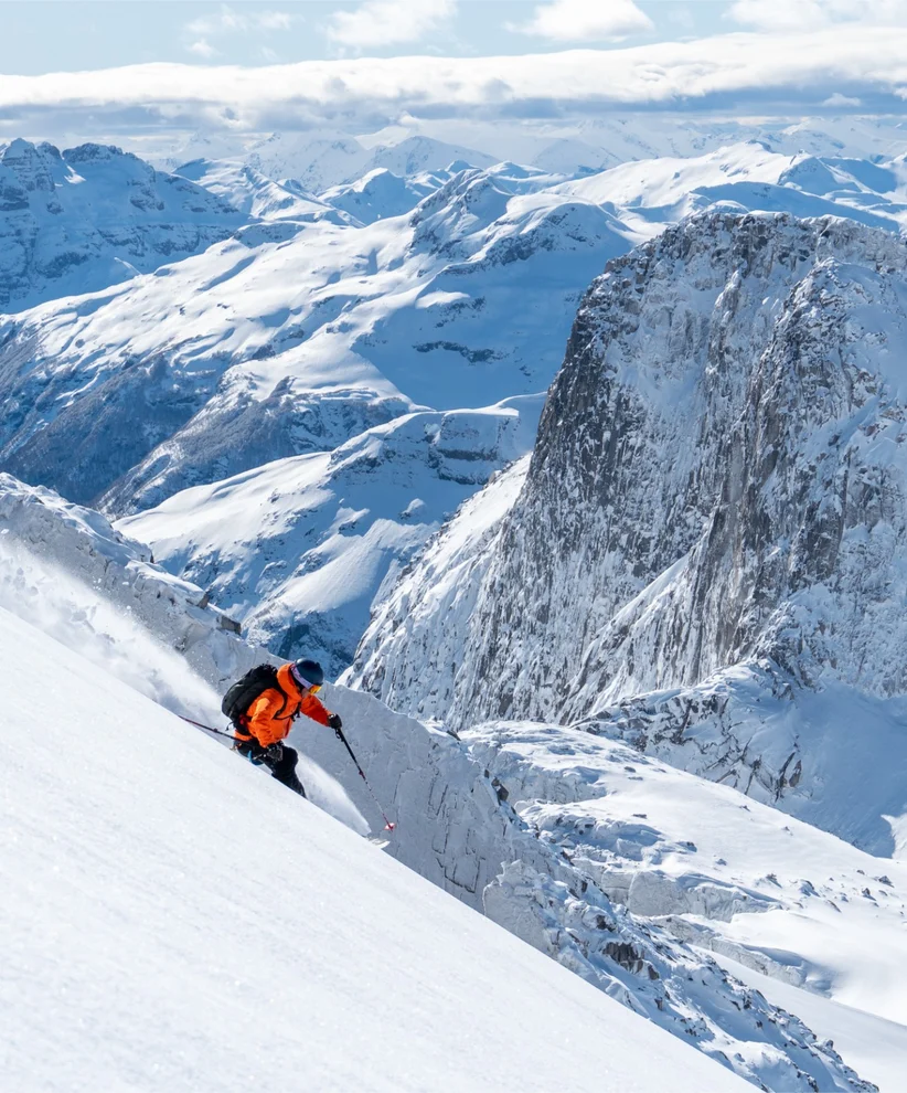 A person skiing downhill in a Chilean mountain range.