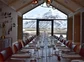 A large dining table in Deplar Farm with views of Icelandic Mountains