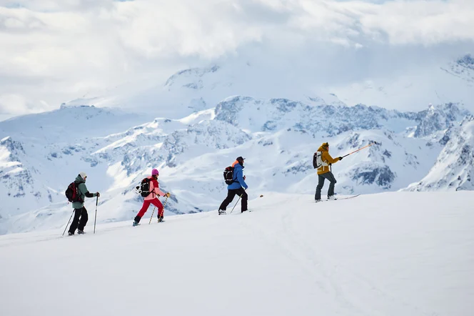 A group ski touring in the Alps.
