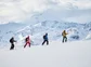 A group ski touring in the Alps.