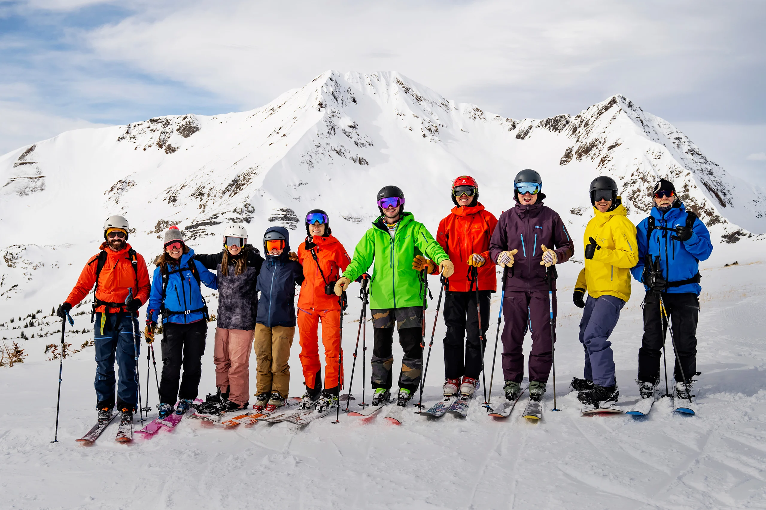 Eleven sales team cat skiing.