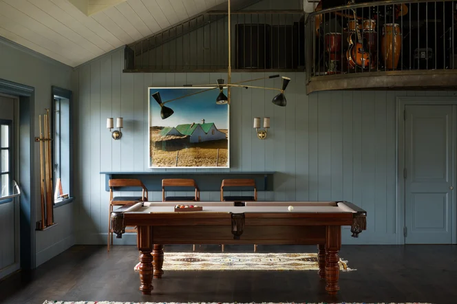 An indoor bar with a pool table.