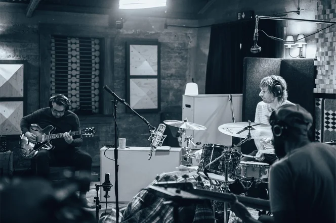 A full band recording a live session.