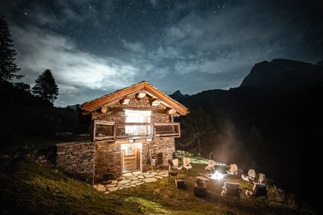 One of the outposts at night with a fire put set up outside.