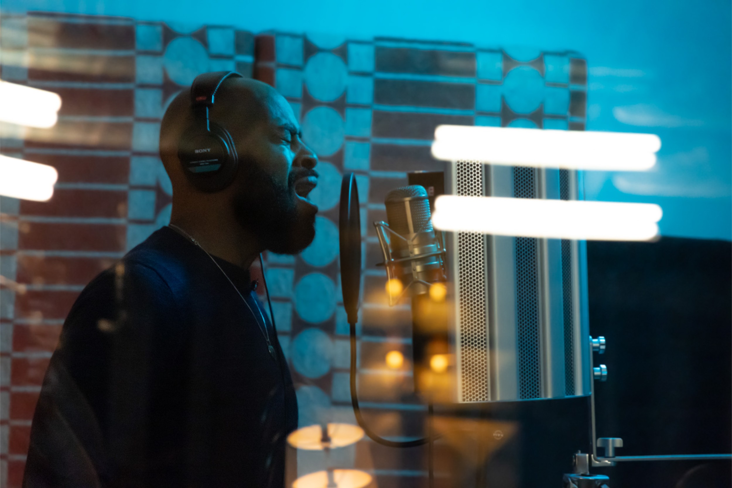 A singer in the vocal booth at Floki.