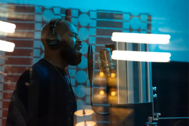 A singer in the vocal booth at Floki.