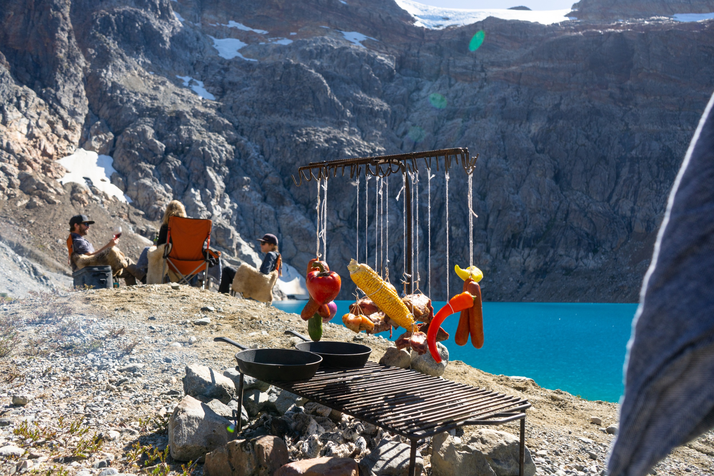 Food cooks over an open flame in Patagonia.