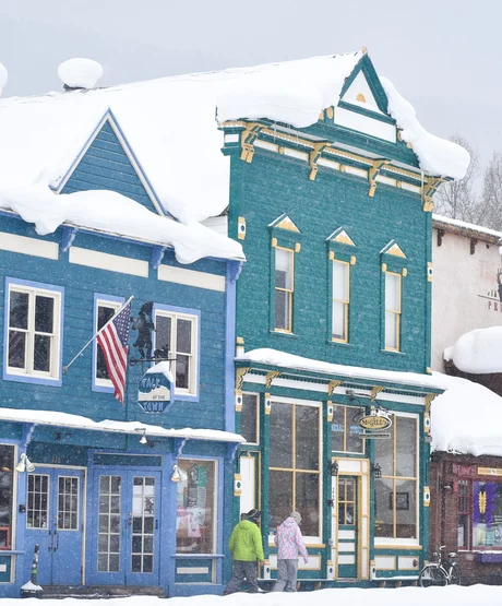 Snow falling on local storefronts in Crested Butte.
