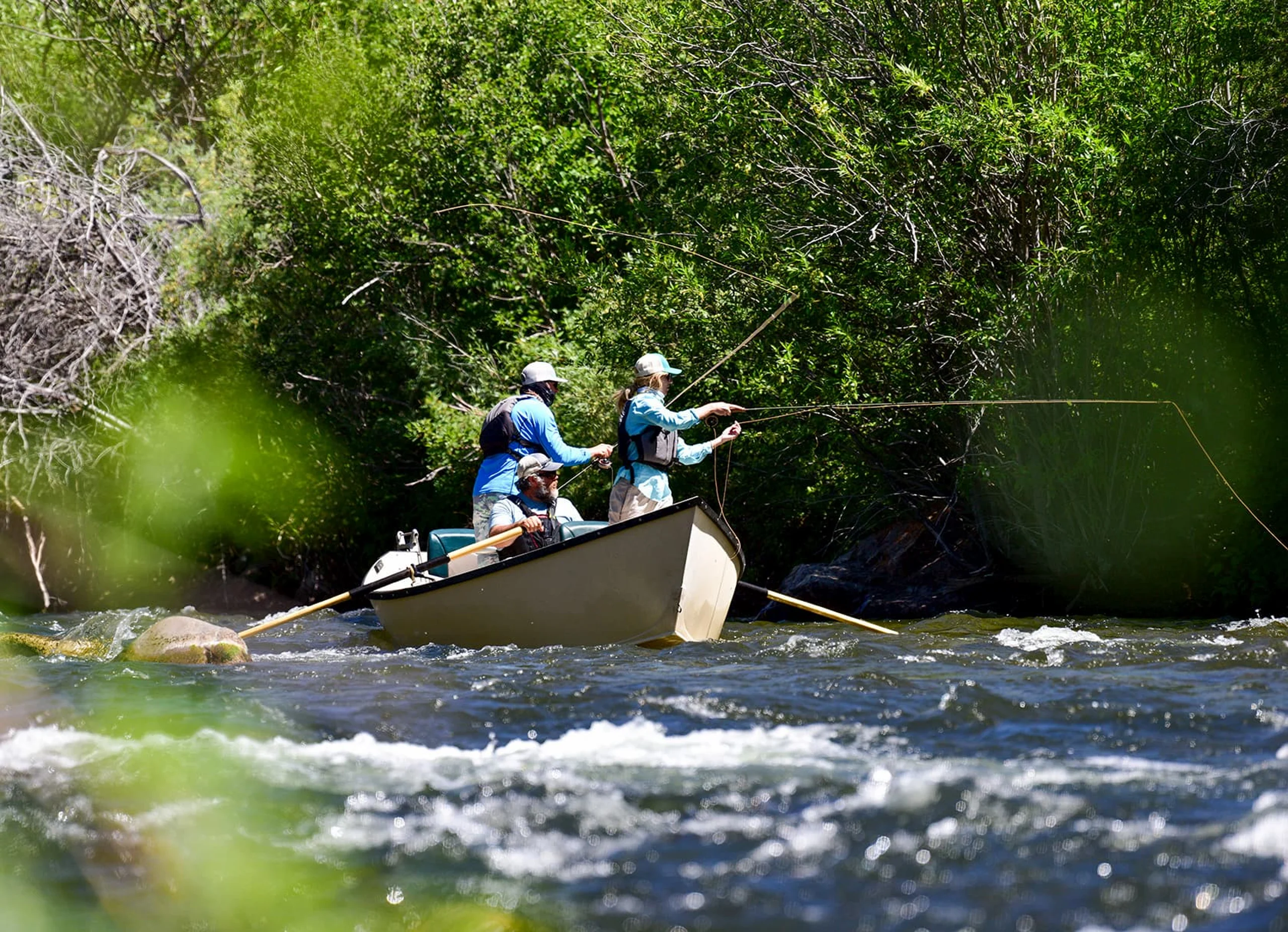 Fly fishing from a boat on the Gunnison River.