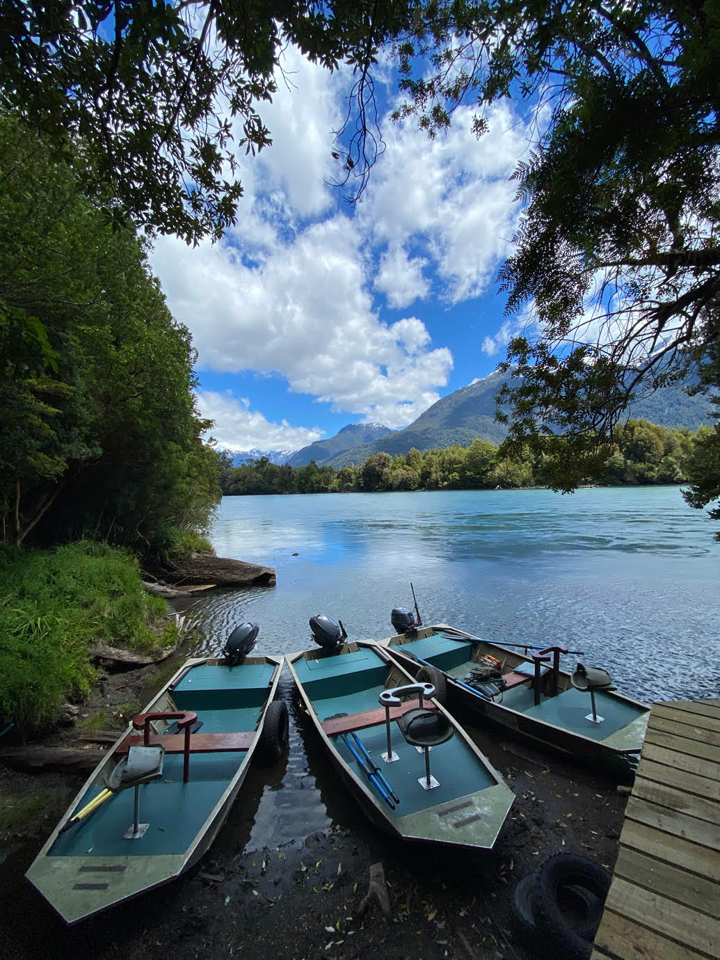 Three boats in river waiting to cast off
