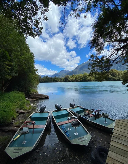 Three boats in river waiting to cast off