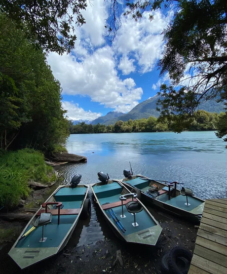 Three boats in river waiting to cast off