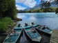 Three boats in river waiting to cast off