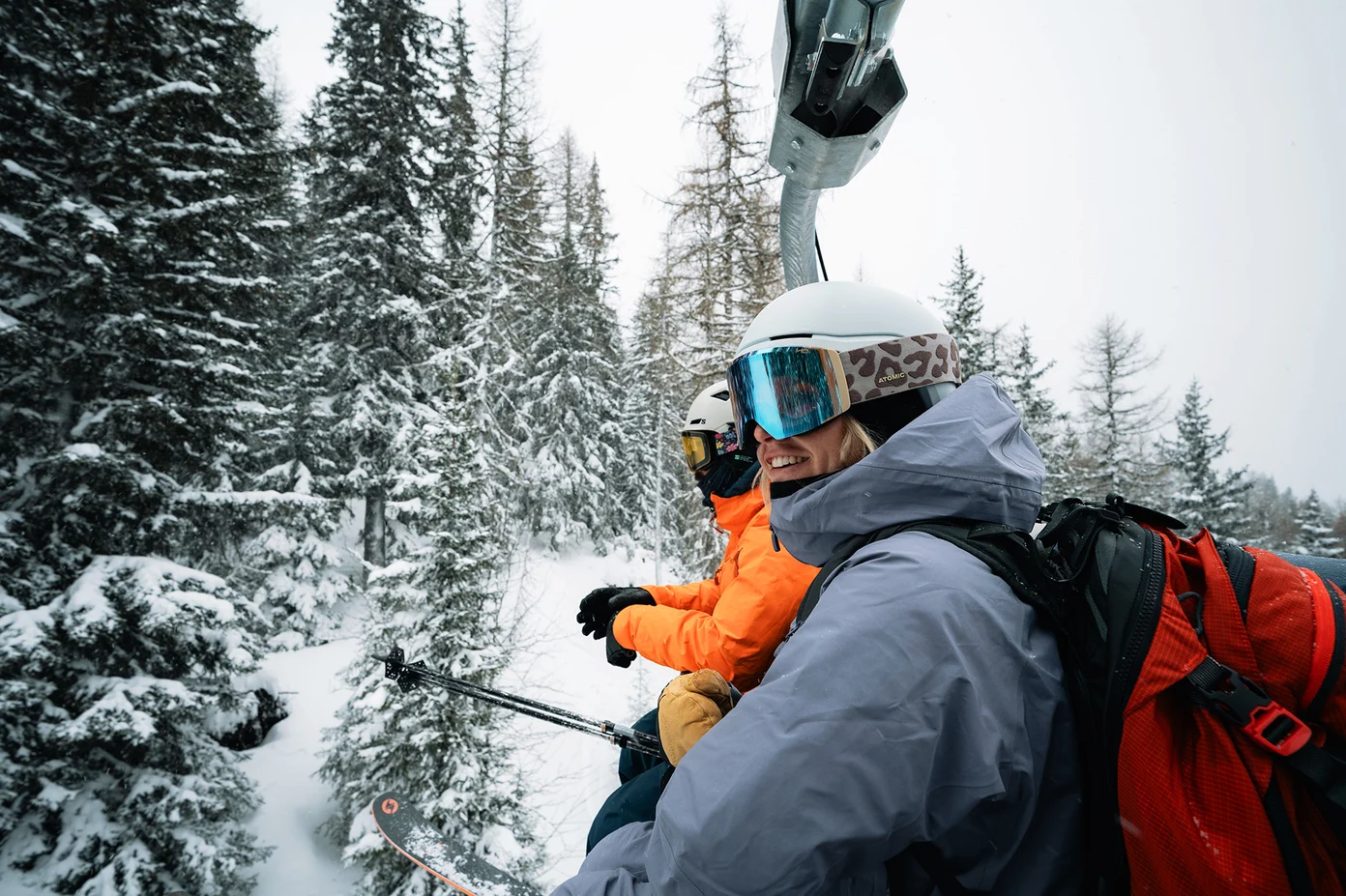 Skiers on chairlift at French resort