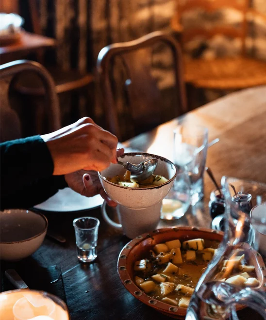 A chef-made meal being served in small bowls.