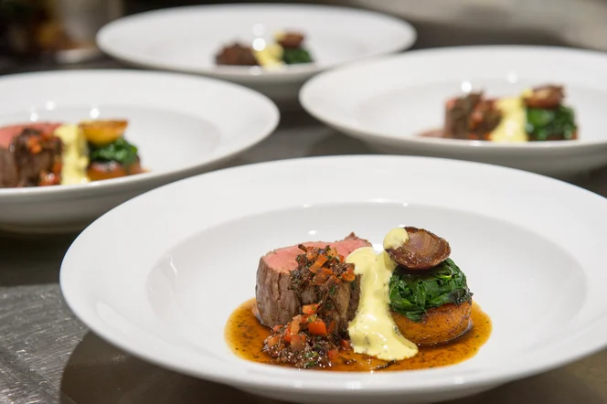 A chef-made plate of steak and reductions.