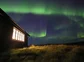 The Northern Lights over the Holkna Studio in Iceland.