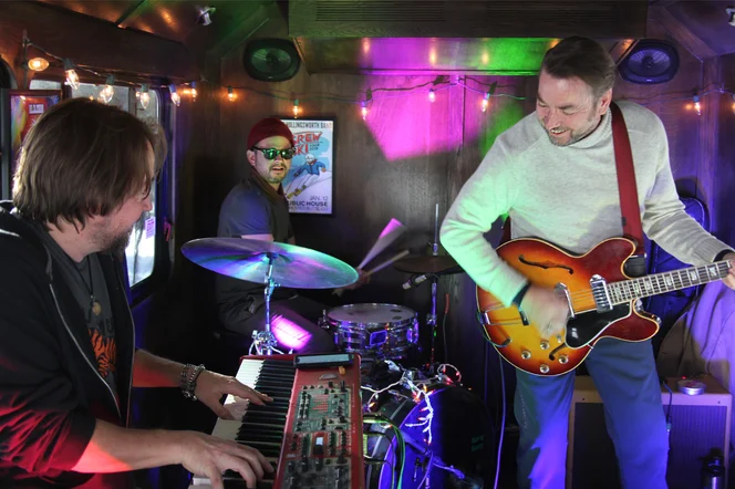 A live band performing music at a bar.