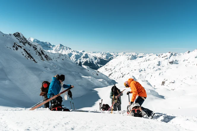 People transitioning while ski touring.